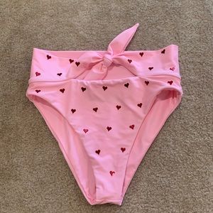 High-waisted, front-tie bikini bottom.